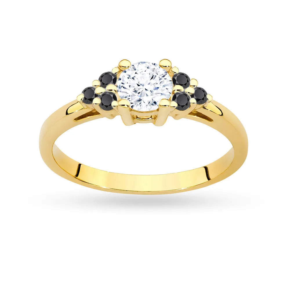 Prsten ze žlutého zlata 14k (585) s bílým safírem o hmotnosti 0,60 ct a šesti černými diamanty. Ideální jako dárek.