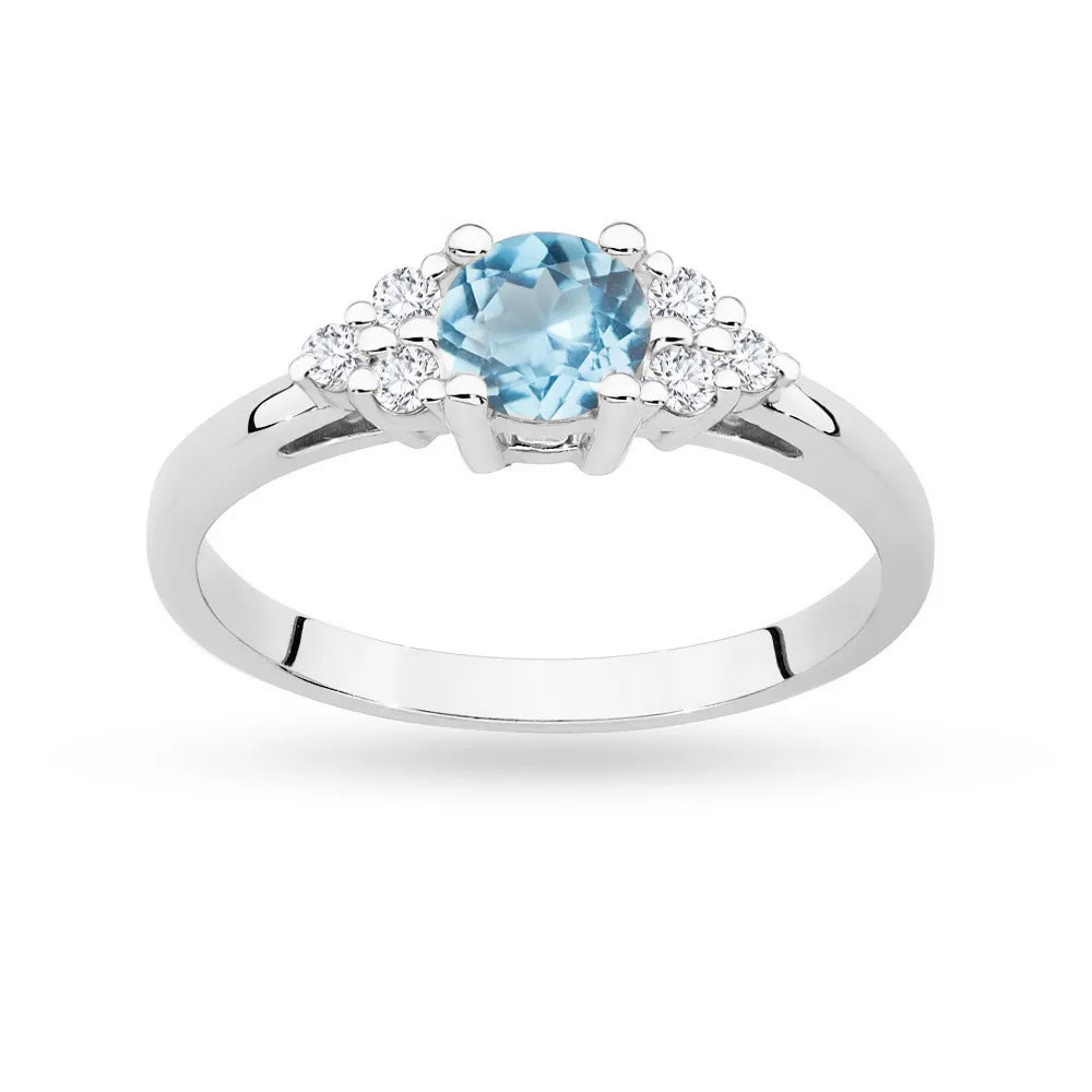 Prsten z bílého zlata 14k (585) s topazem 0,50 ct a 6 diamanty. Perfektní jako dárek.