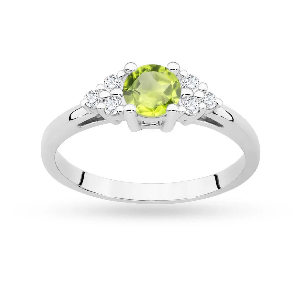 Prsten z bílého zlata 14k (585) s olivínem 0,60 ct a 6 diamanty. Skvělý jako dárek.