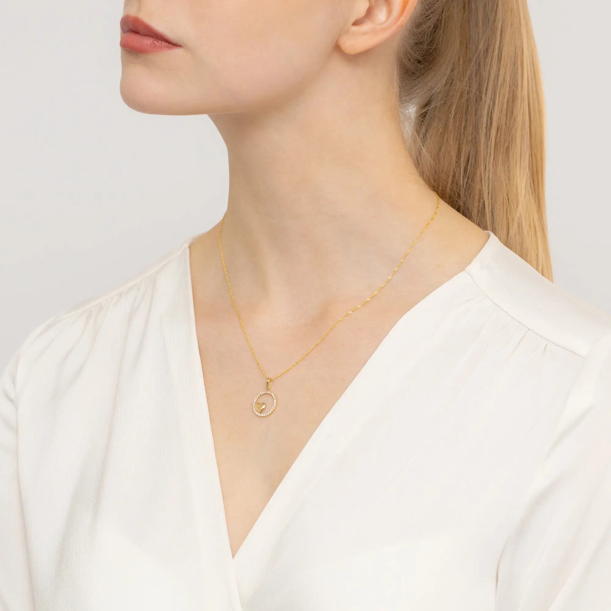 Exquisite gold pendant made from luminous 585 gold. Its warm golden tone complements the clarity of the zirconia.