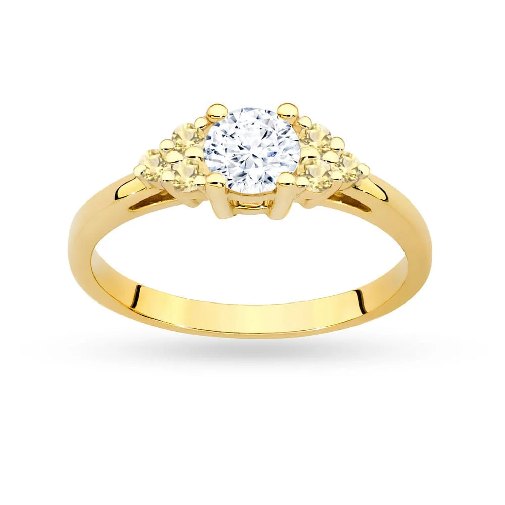 Prsten ze žlutého zlata 14k(585) s bílým safírem o hmotnosti 0,60 ct a šesti bronzovými diamanty. Skvělý jako dárek.