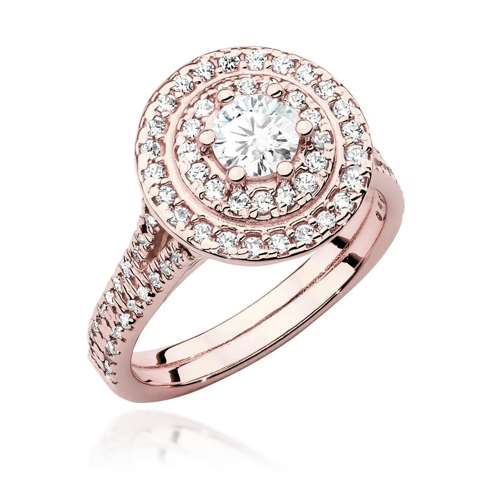 Náušnice z růžového zlata 14k(585) s diamantem 0,40 ct a postranními diamanty 0,613 ct. Balené v elegantní krabičce, která je ideální jako dárek.