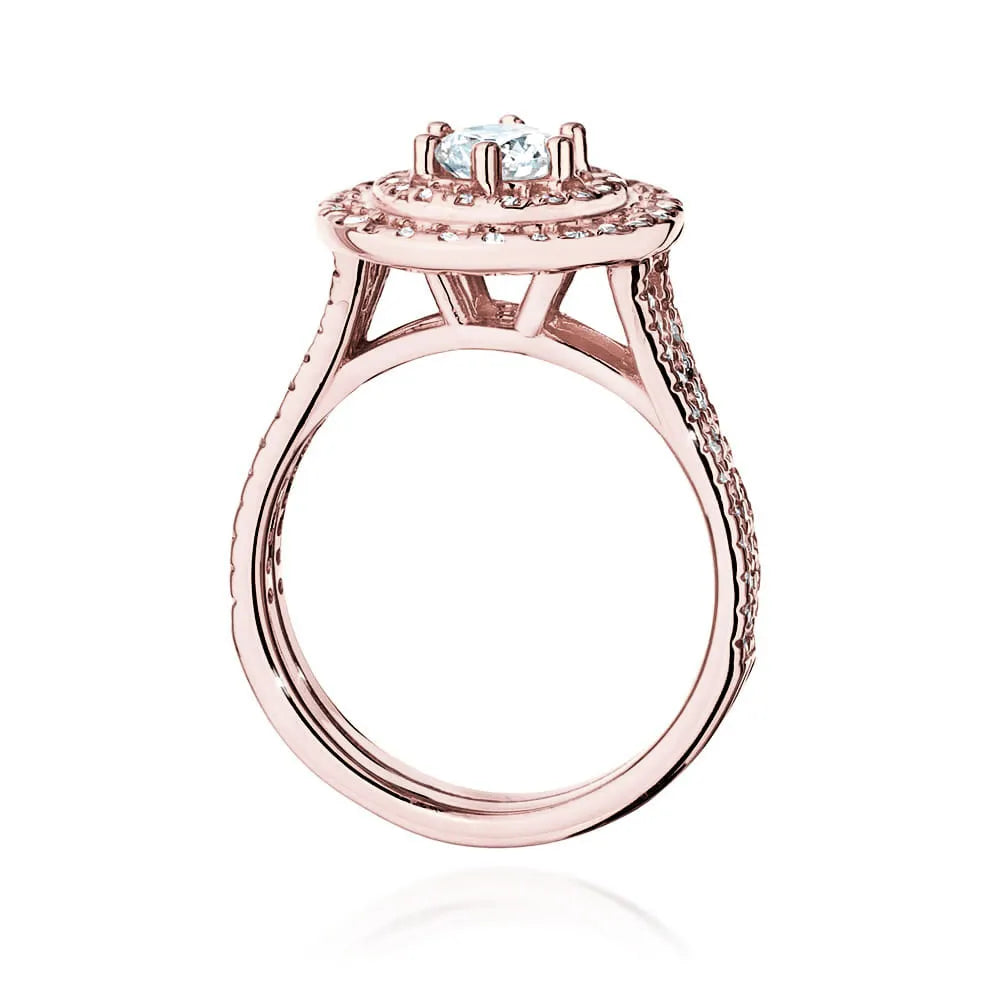Náušnice z růžového zlata 14k(585) s diamantem 0,40 ct a postranními diamanty 0,613 ct. Balené v elegantní krabičce, která je ideální jako dárek.