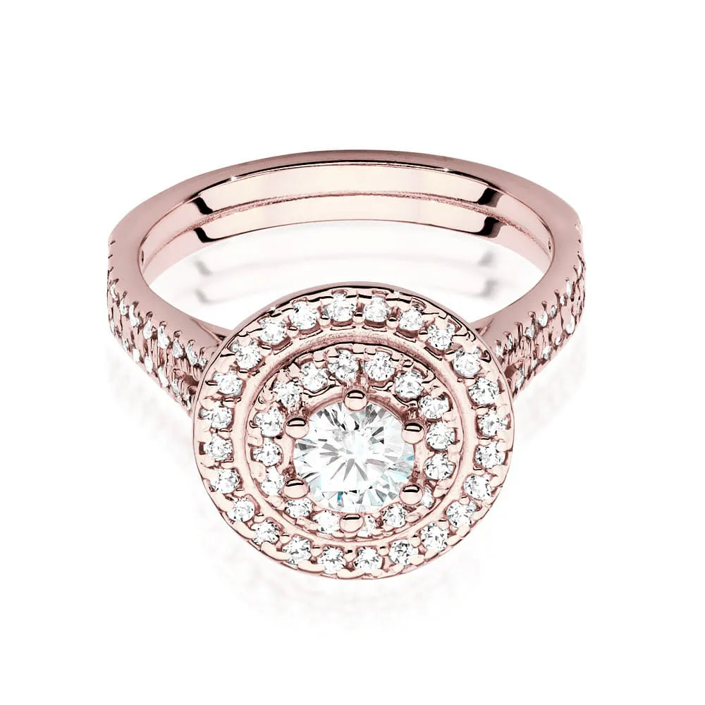 Náušnice z růžového zlata 14k(585) s diamantem 0,40 ct a postranními diamanty 0,613 ct. Balené v elegantní krabičce, která je ideální jako dárek.