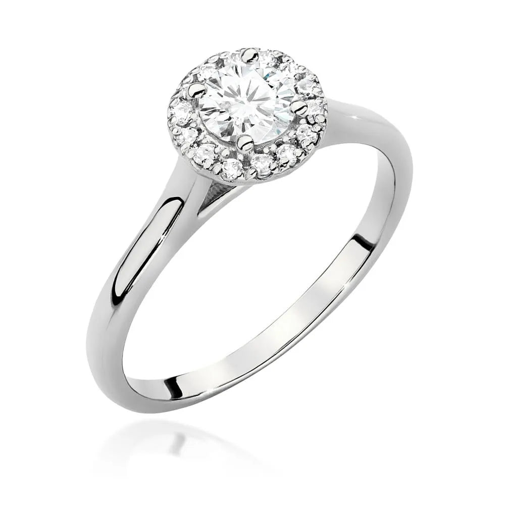 Prsten z bílého zlata 14k(585) s diamantem 0,40 ct a postranními diamanty 0,12 ct. Skvělý jako dárek.