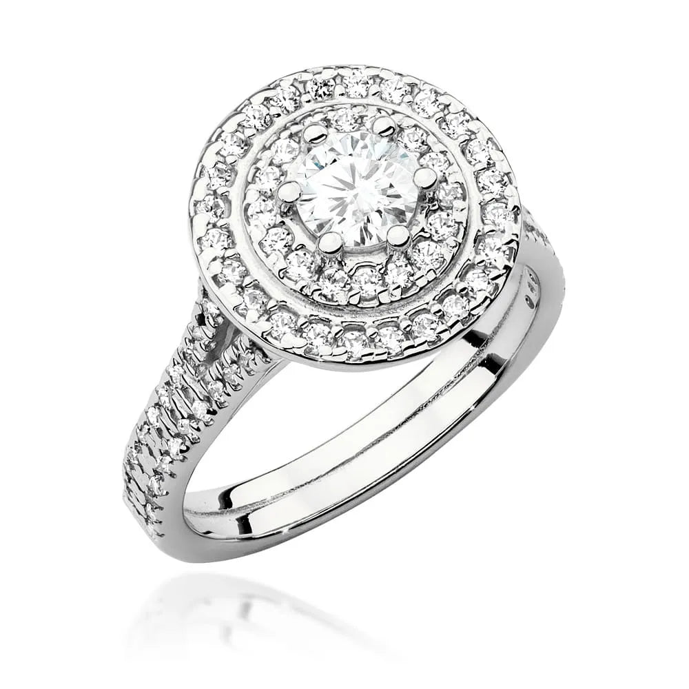 Náušnice z bílého zlata 14k (585) s diamantem o hmotnosti 0,40 ct a postranními diamanty o celkové hmotnosti 0,613 ct. Balené v elegantní krabičce, která je ideální jako dárek.