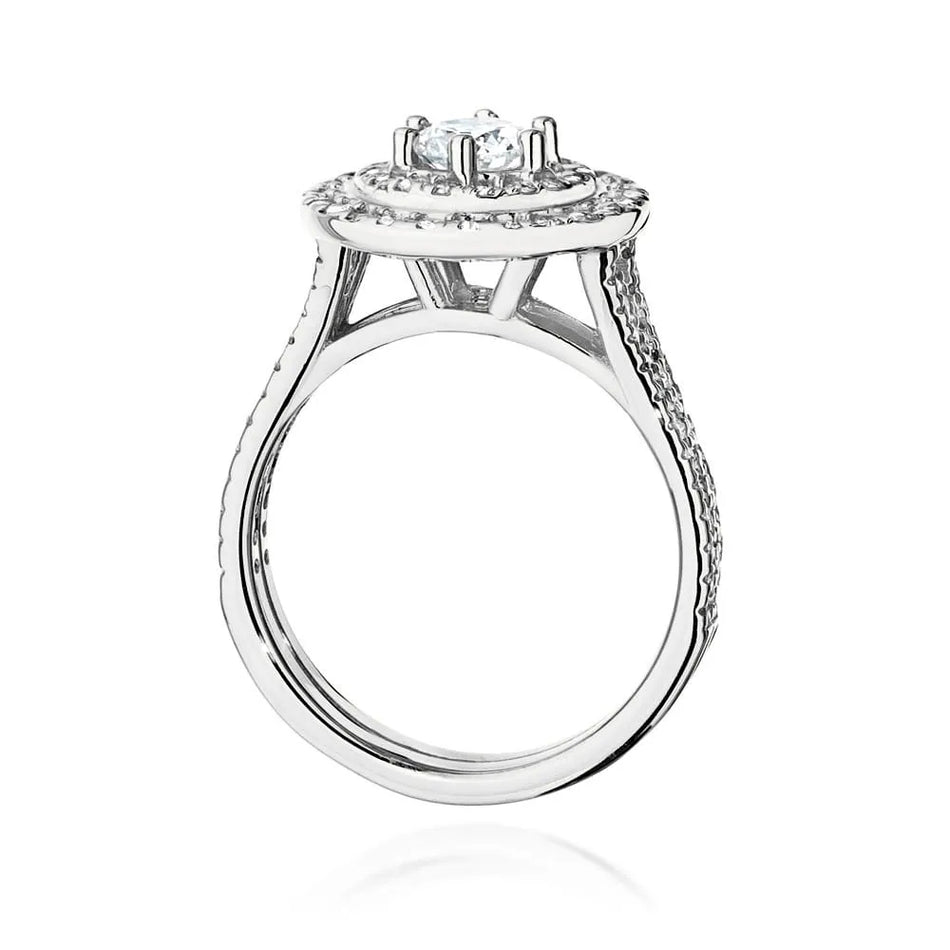 Náušnice z bílého zlata 14k (585) s diamantem o hmotnosti 0,40 ct a postranními diamanty o celkové hmotnosti 0,613 ct. Balené v elegantní krabičce, která je ideální jako dárek.