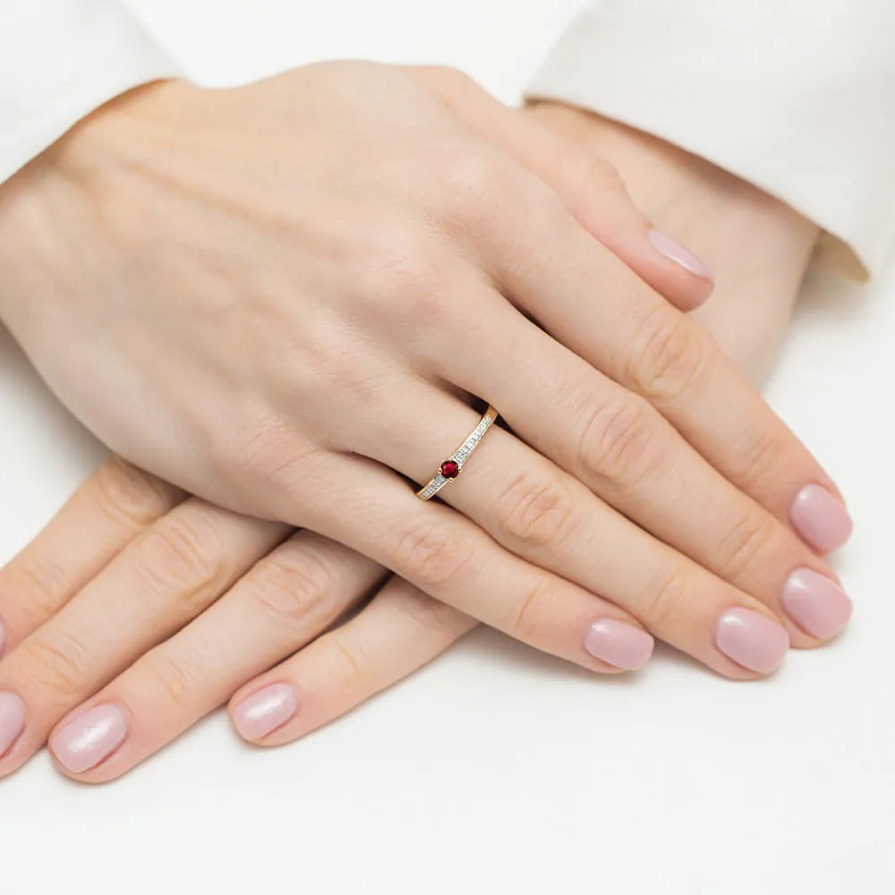 14k gold ring with 0.15ct ruby and 0.05ct diamonds. Packed in black box, paper and gift bag.