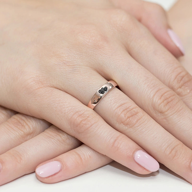 14k rose gold ring with 2 black zirconia hearts. Classic design with modern twist. Packed in black box, paper, and gift bag.