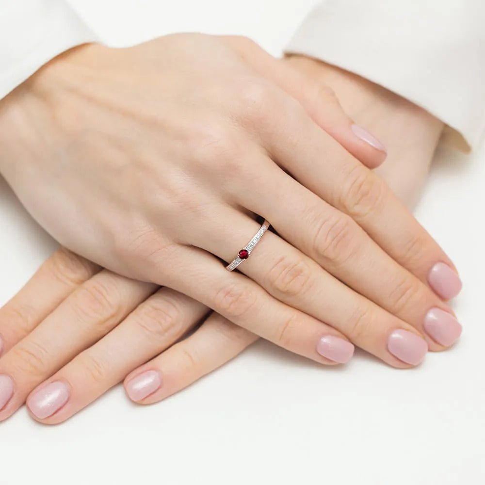 14k rose gold ring with 0.15ct ruby and 0.05ct diamonds. Packed in black box, paper and gift bag.
