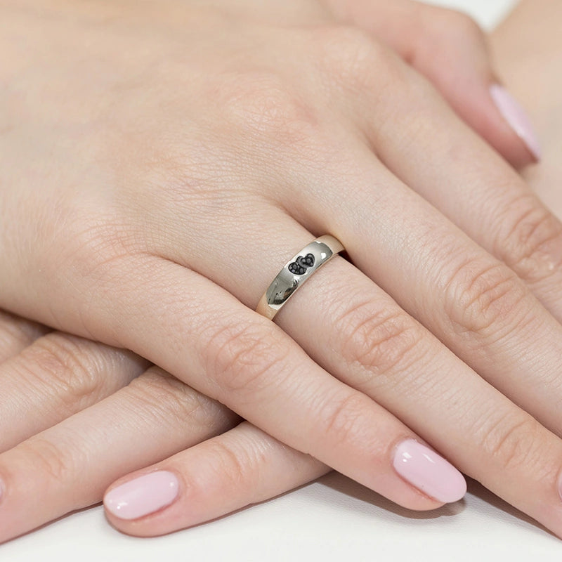 14k white gold ring with 2 black zirconia hearts. Classic design with modern twist. Packed in black box, paper, and gift bag.