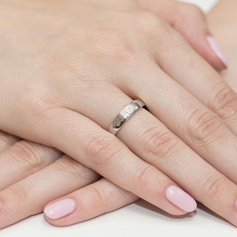 14k white gold ring with 2 white zirconia hearts. Classic design with modern twist. Packed in black box, paper, and gift bag.