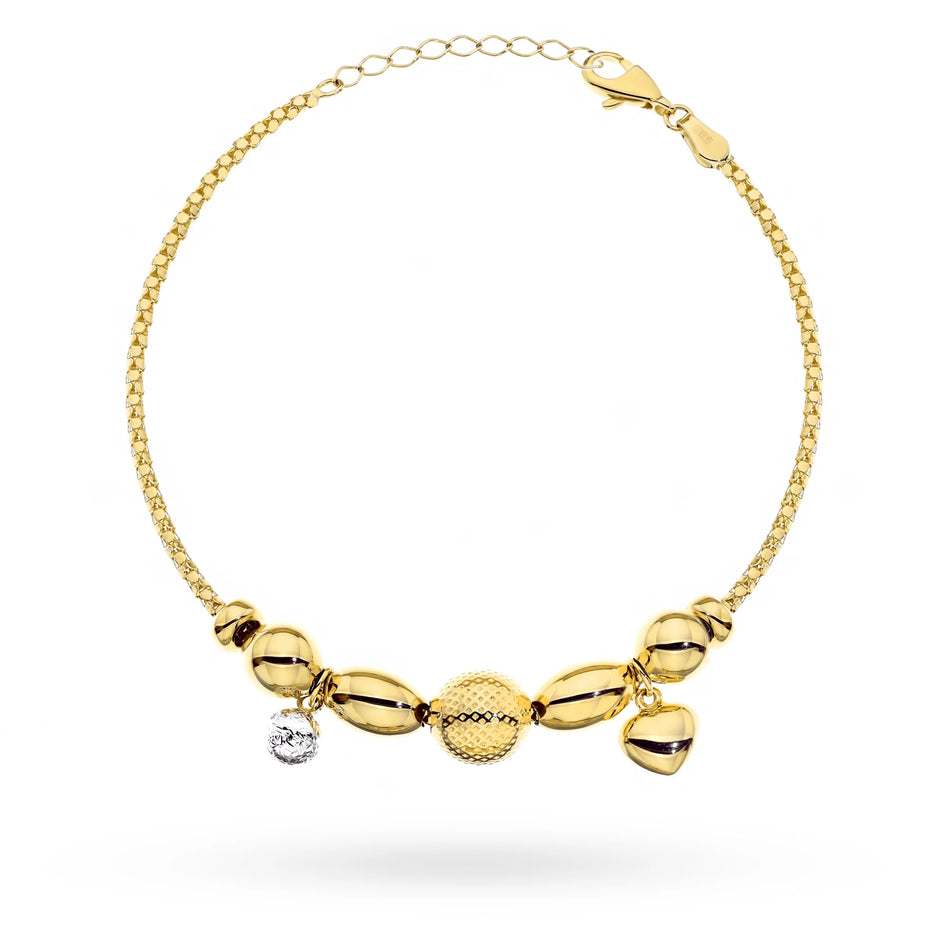Gold two-tone bracelet with decorated beads and a heart