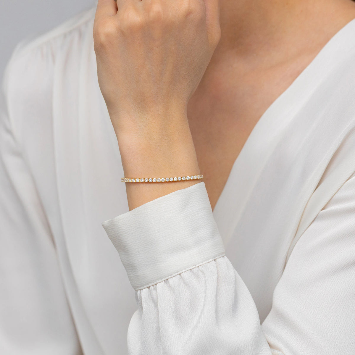 GREMARI 14K yellow gold tennis bracelet with 3.48ct round lab-grown diamonds – four-prong setting detail