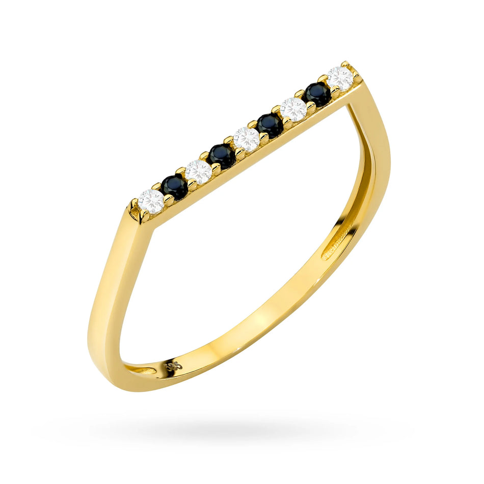 Zlatý prsten s černými a bílými zirkony