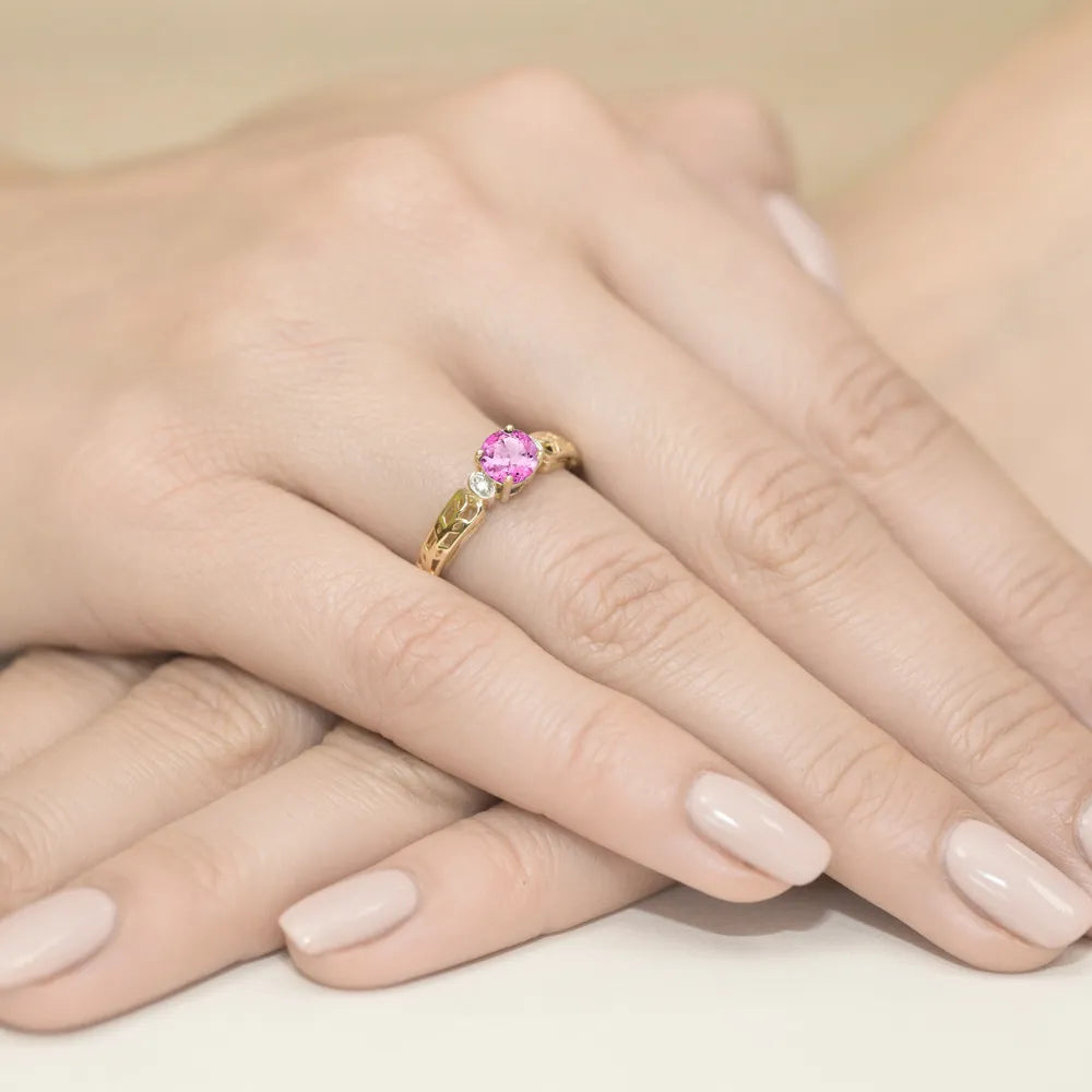 gold-ring-with-0-60ct-pink-topaz-and-0-02ct-diamonds-w0014-top-01