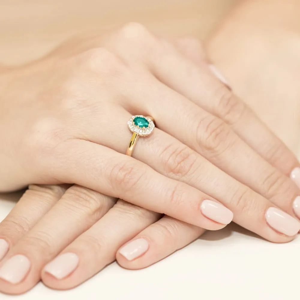 gold-ring-with-0-40ct-emerald-and-0-069ct-diamonds-w0304-emg-01