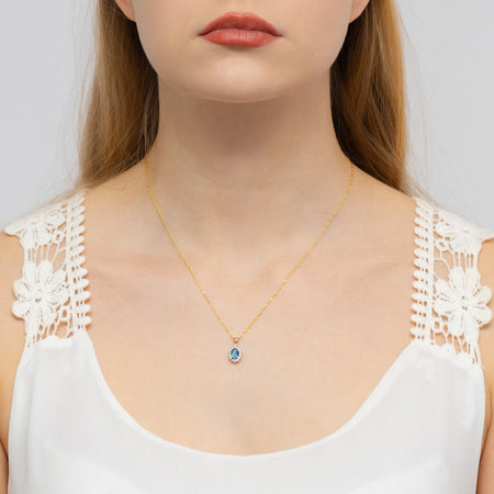 gold-pendant-with-0-50ct-topaz-london-blue-and-0-12ct-diamonds-z0182-tol-01