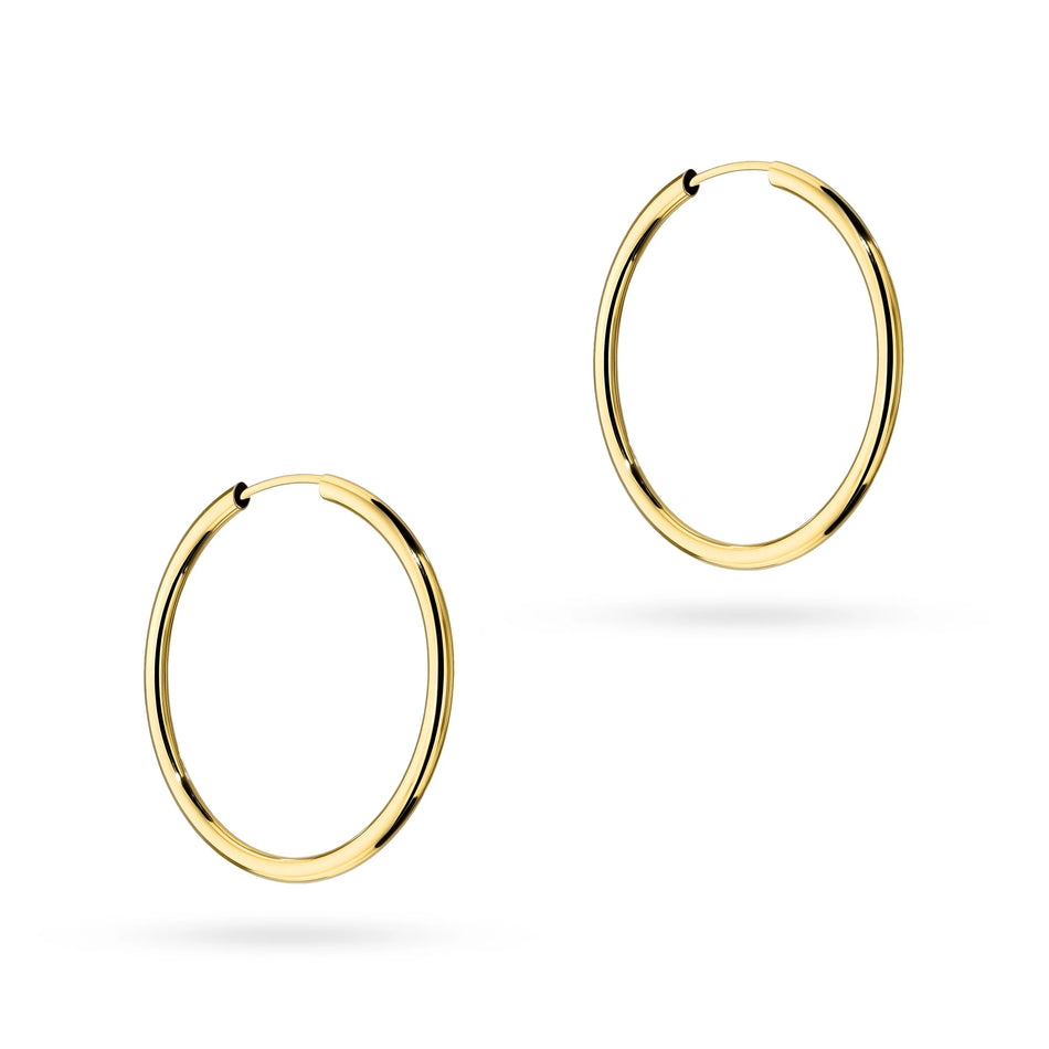 These classic hoop 14-carat gold earrings are an exclusive accessory. Our earrings are a stud clasp. Earrings are packaged in elegant box, perfect for a gift