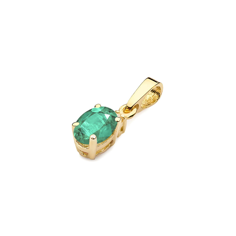 Gold pendant with oval emerald and additional diamonds.