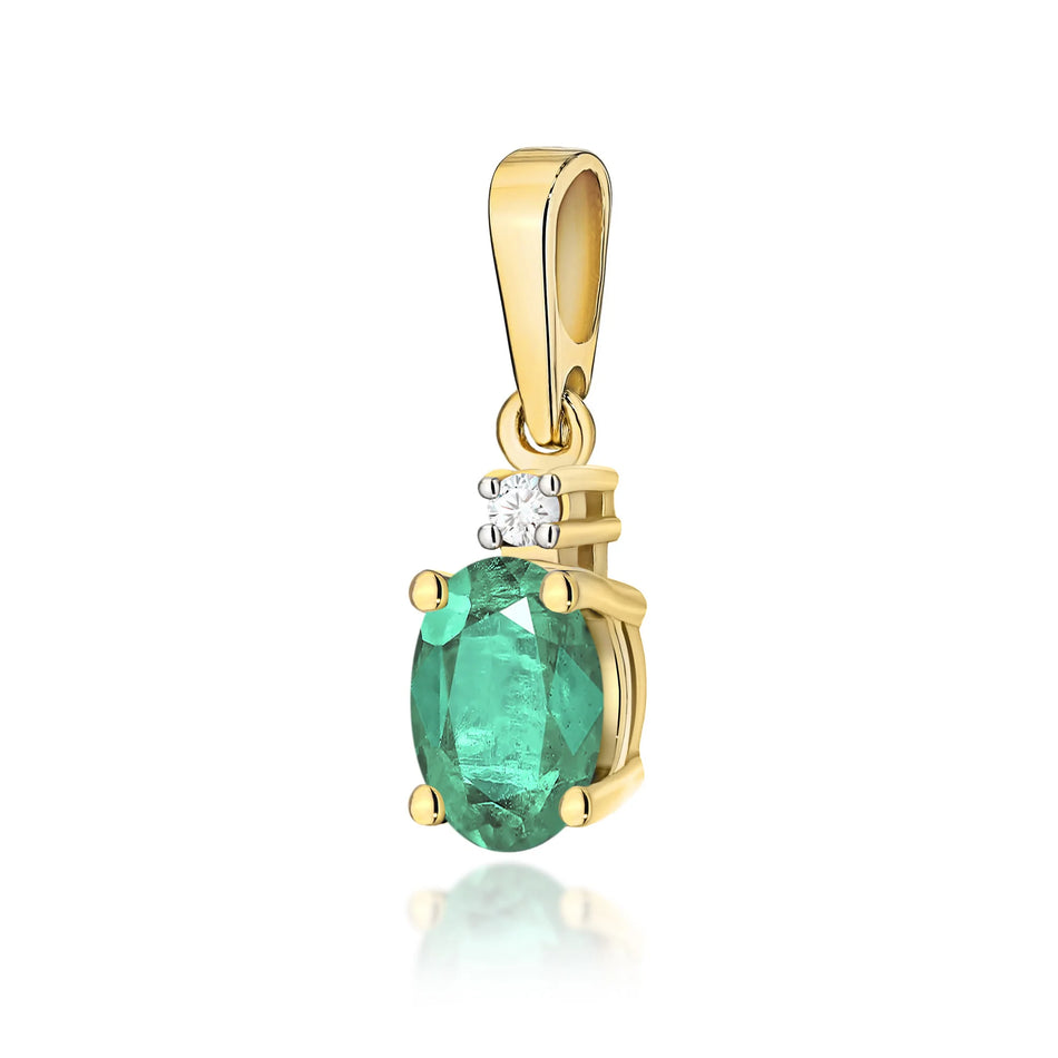 Gold pendant with oval emerald and additional diamonds.