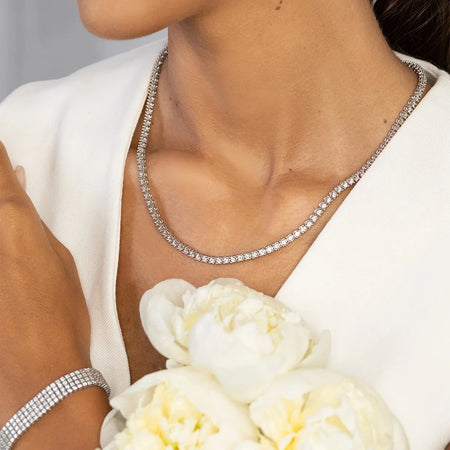 This 14-carat gold necklace with 115 0.06ct diamonds embodies timeless beauty . Perfect for a gift.